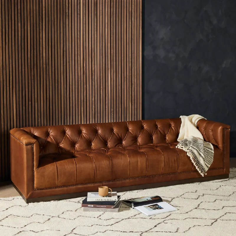 A close-up of a brown tufted leather upholstery sofa.