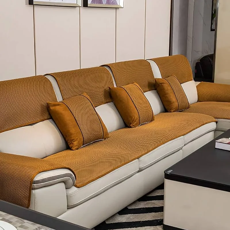 Camel textured sofa covers and matching throw pillows.