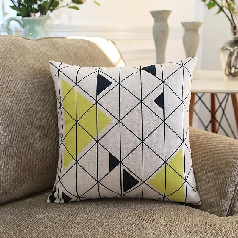 Lime and navy geometric patterned throw pillow upholstery.