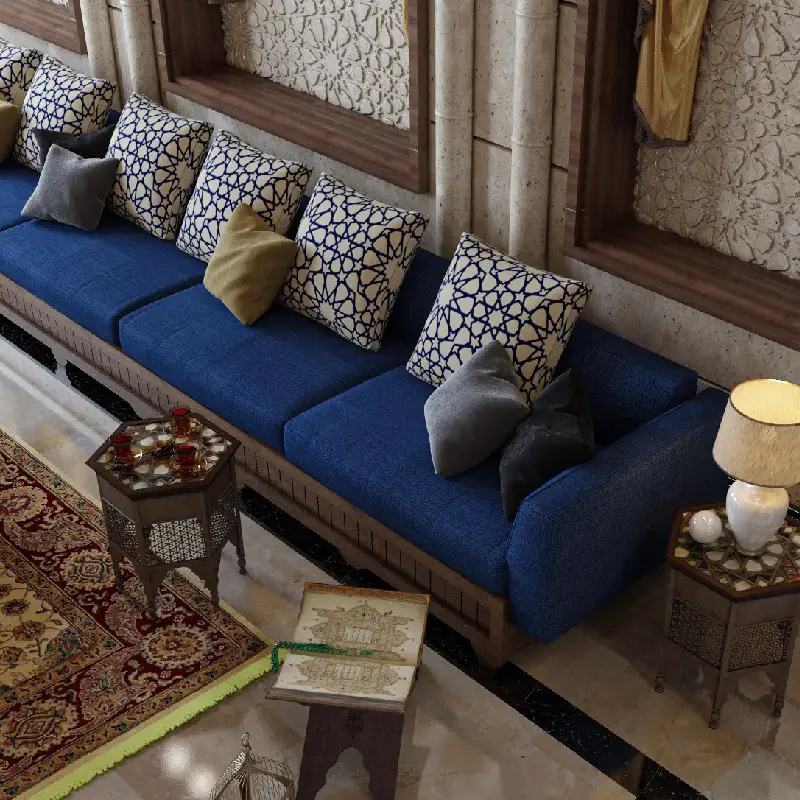 Moroccan majlis with a low blue sofa, patterned pillows