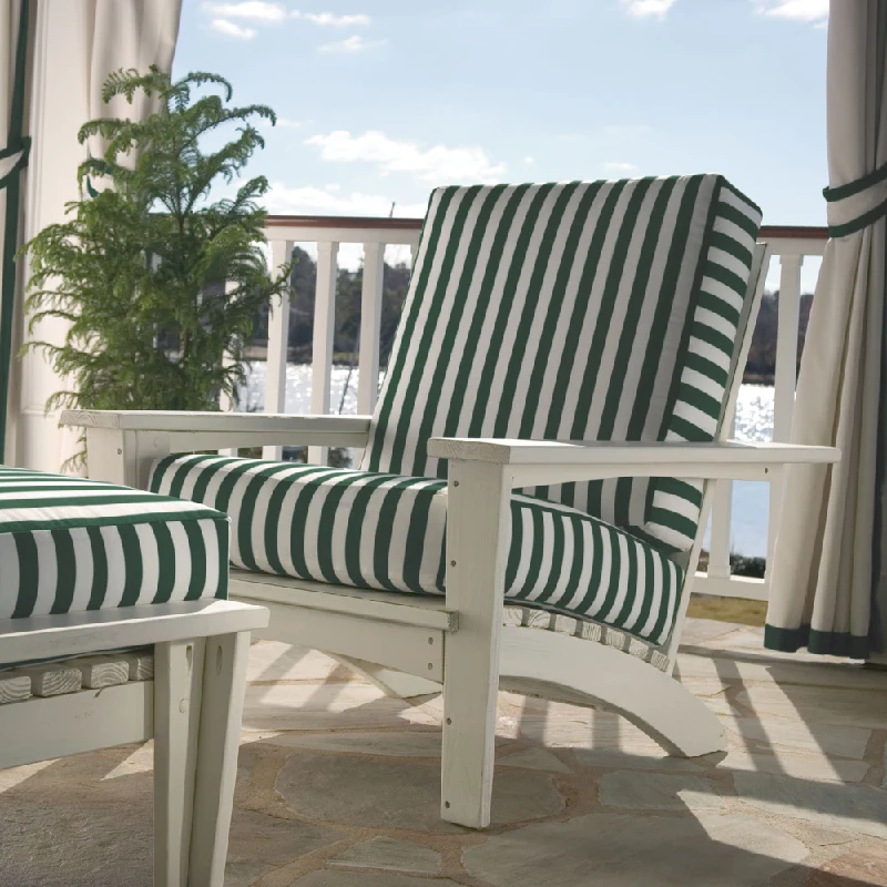 White patio chair with green and white striped outdoor upholstery