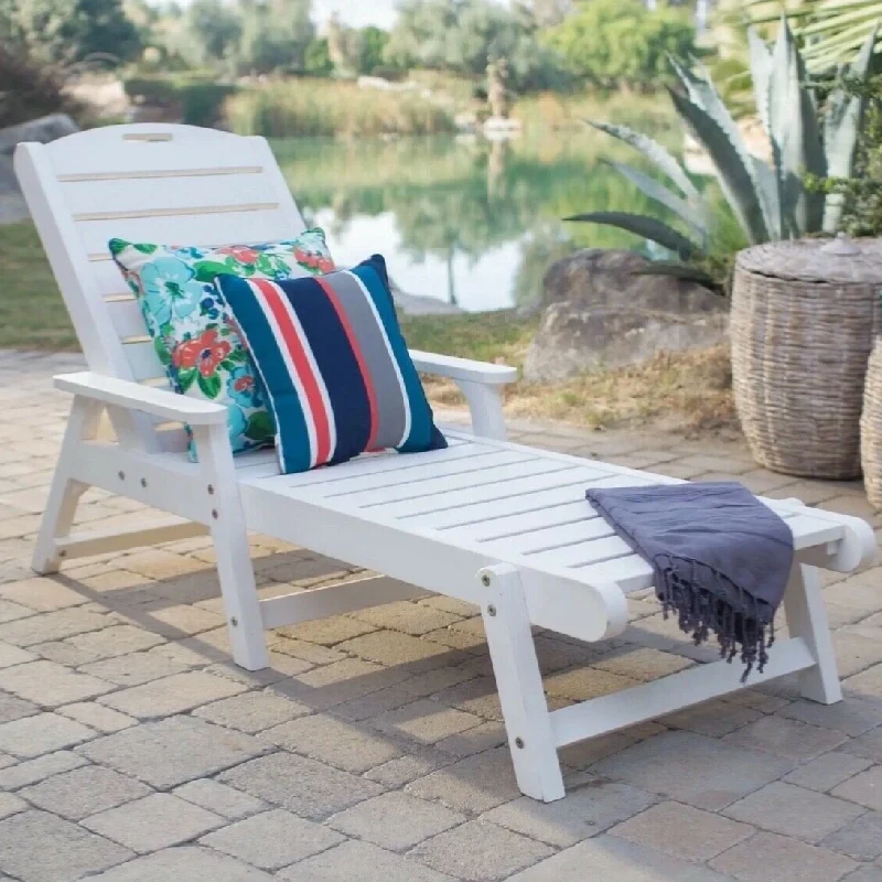White slatted chaise lounge with decorative pillows.
