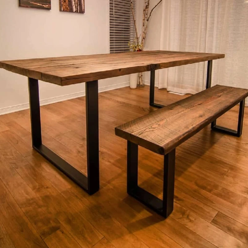 a well-maintained rustic wooden dining table and a matching bench