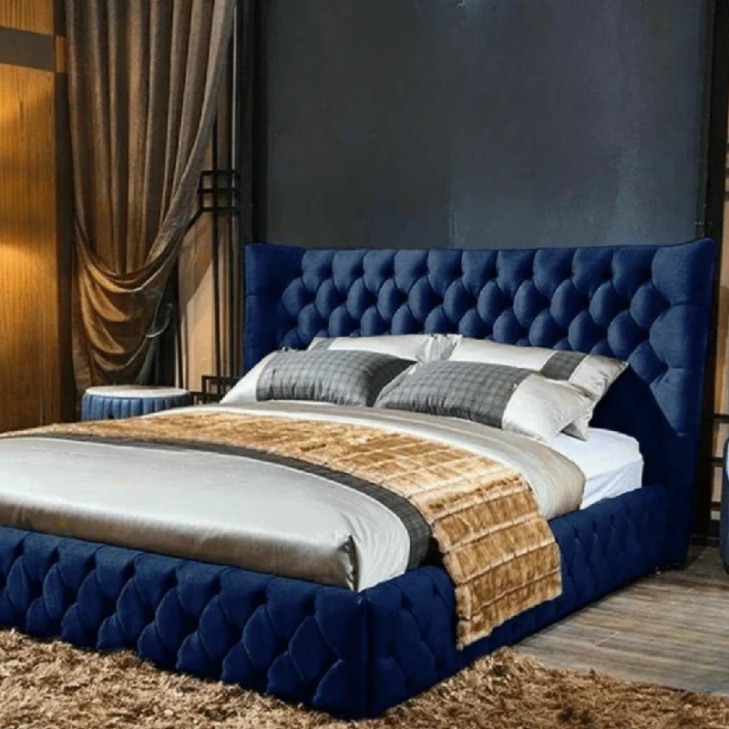 deep blue, velvet upholstered bed frame with a scalloped, tufted headboard