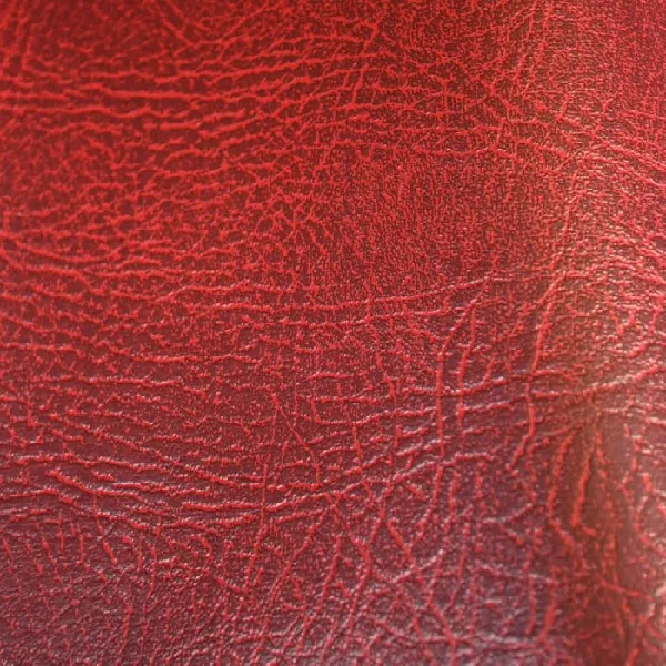 distressed red leather upholstery fabric.