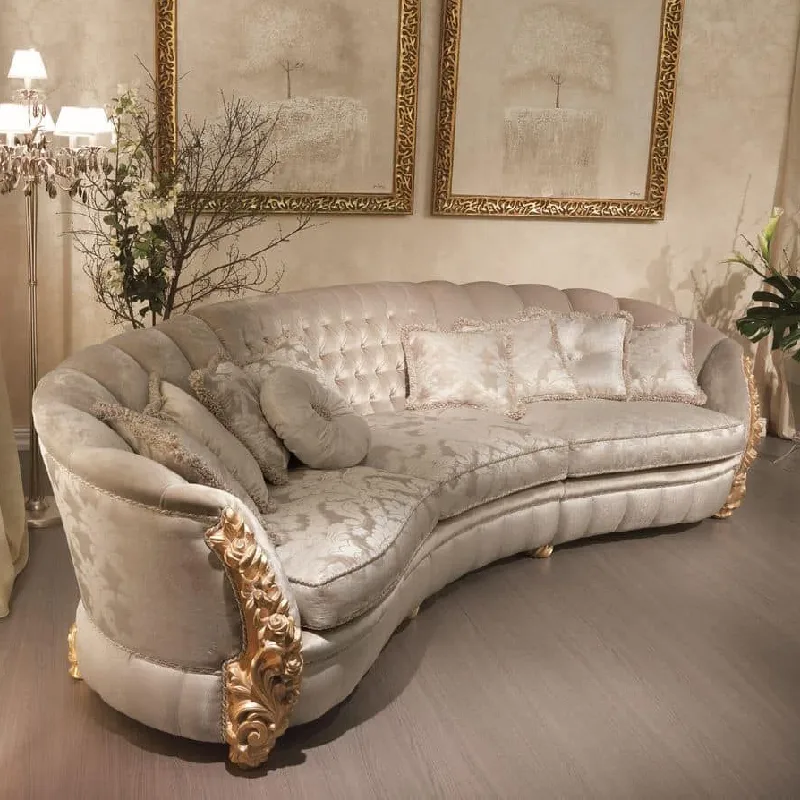elegant sofa with a detailed cream-colored damask pattern and tufted back