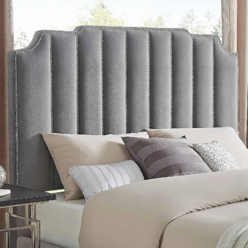gray upholstered headboard with vertical channel tufting and crystal trim