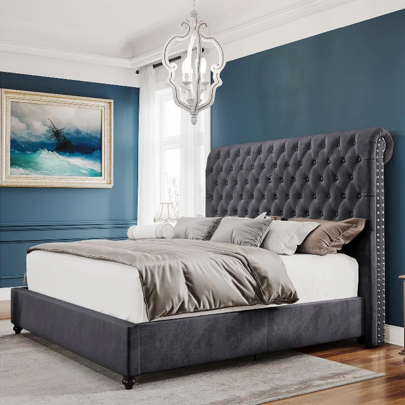 gray, velvet upholstered bed frame with a tufted headboard