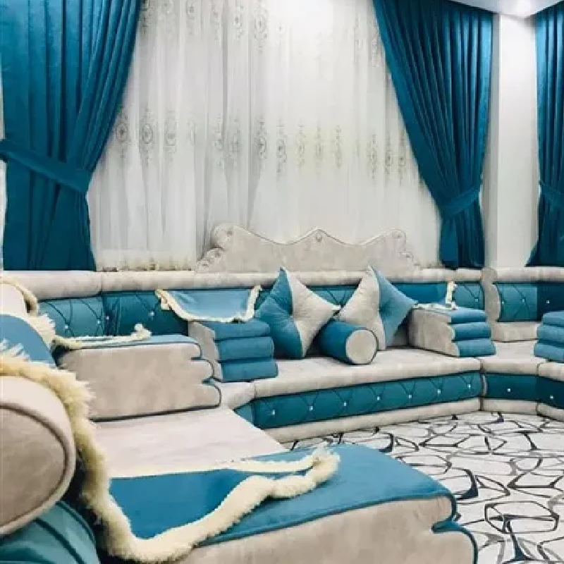 modern Arabic majlis, featuring white and turquoise floor cushions and throw pillows