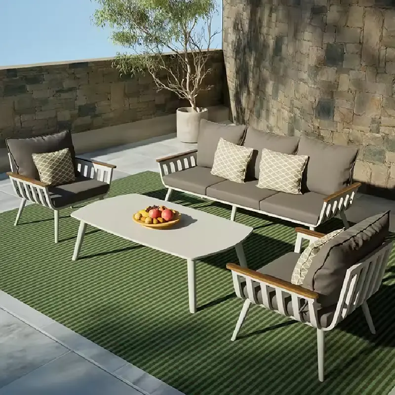 outdoor patio, a table and two chairs, all featuring gray outdoor cushions