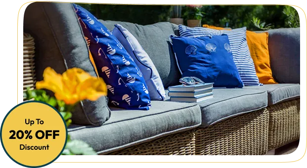 patio couch with gray outdoor cushions is decorated with colorful pillows