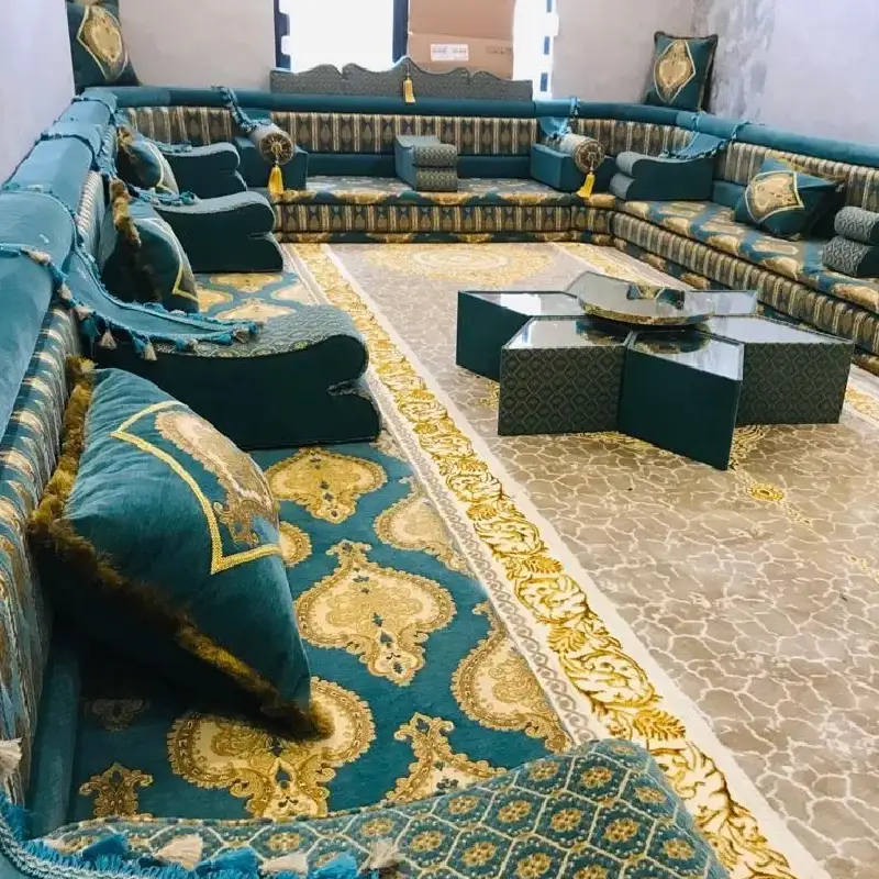 traditional Arabic majlis, featuring intricate teal and gold patterned floor cushions