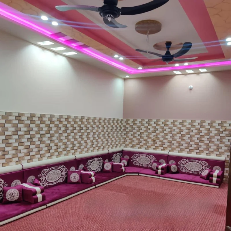 traditional Arabic majlis with a purple L-shaped floor sofa