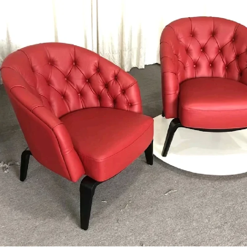 vibrant red leather armchair with tufted upholstery