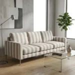 Beige striped fabric upholstered sofa in modern interior