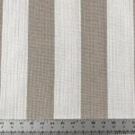 Beige striped upholstery fabric swatch with ruler detail