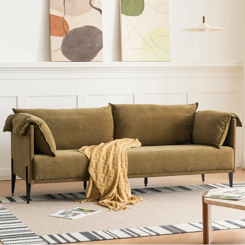 Blue tufted Chesterfield sofa upholstery in grey room