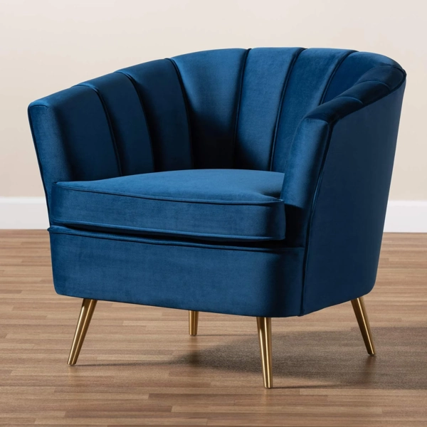 Blue velvet armchair upholstery with gold legs in living room