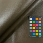 Brown faux leather vinyl upholstery swatch with color card