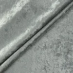 Close up macro texture shot of grey crushed velvet fabric