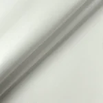 Close up macro texture shot of white vinyl upholstery fabric