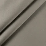 Close up texture shot of smooth taupe upholstery fabric