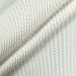Close up texture shot of white textured upholstery fabric