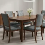 Dark grey faux leather dining chairs around wooden table