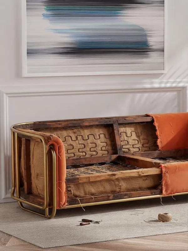 Orange channel tufted velvet sofa in modern interior