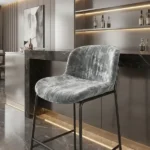Grey crushed velvet bar stool in modern interior space