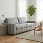 Grey striped fabric upholstered sofa in modern living room