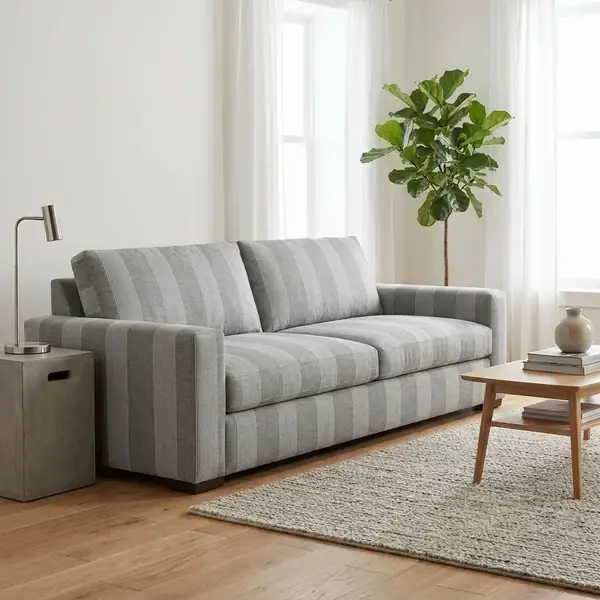 Grey striped fabric upholstered sofa in modern living room