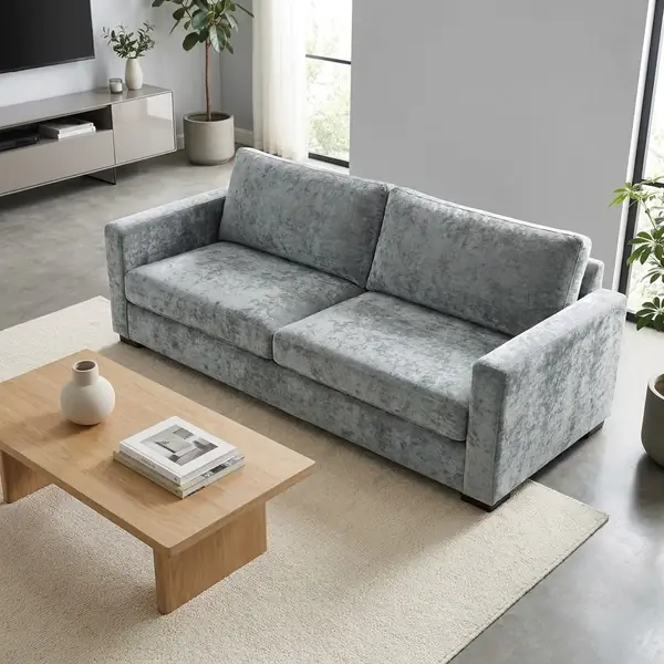 Grey velvet sofa in bright minimalist living room setting