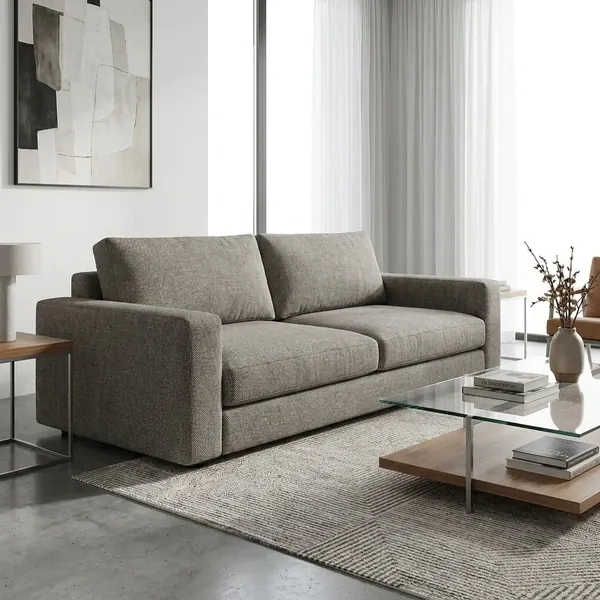 Modern grey fabric upholstered sofa in minimal living room