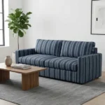 Modern sofa with blue striped upholstery in living room