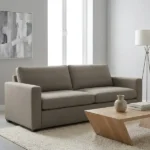 Modern taupe upholstered fabric sofa in living room setup