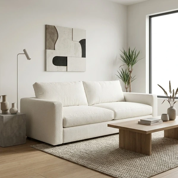 Modern white fabric upholstered sofa in minimal living room