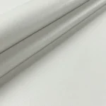 Off white faux leather vinyl fabric swatch folded detail