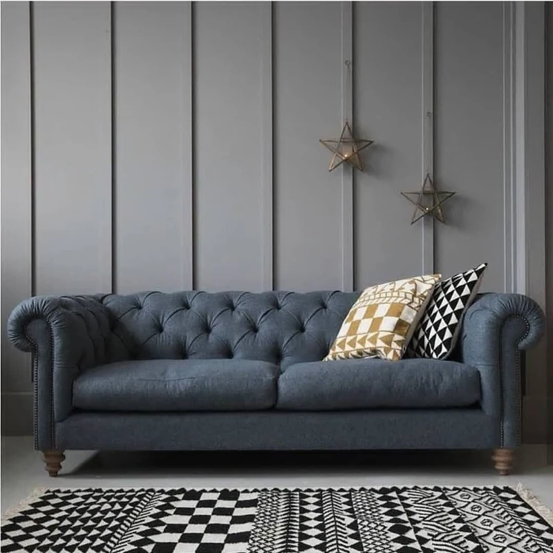 Olive green fabric sofa upholstery in minimalist space