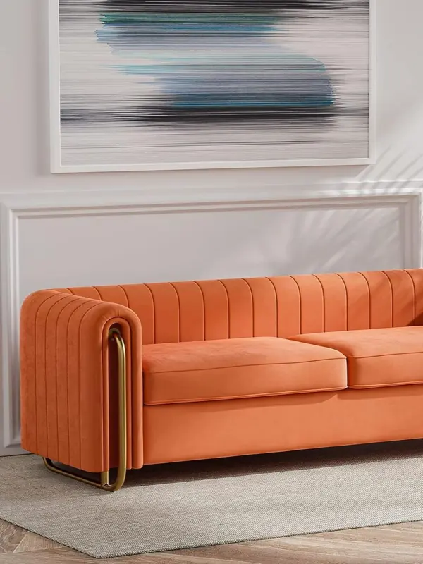 Exposed wooden frame of an orange sofa during repair