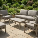 Outdoor patio wooden seating set with grey upholstered seats