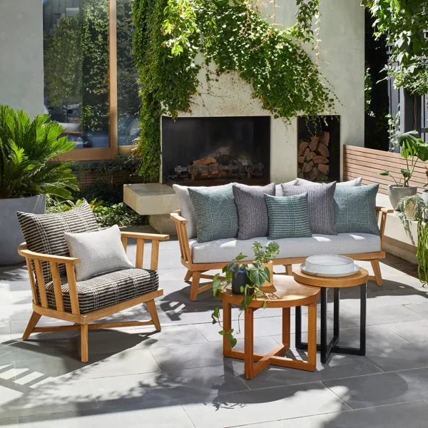 Teak wood outdoor patio lounge set on stone patio
