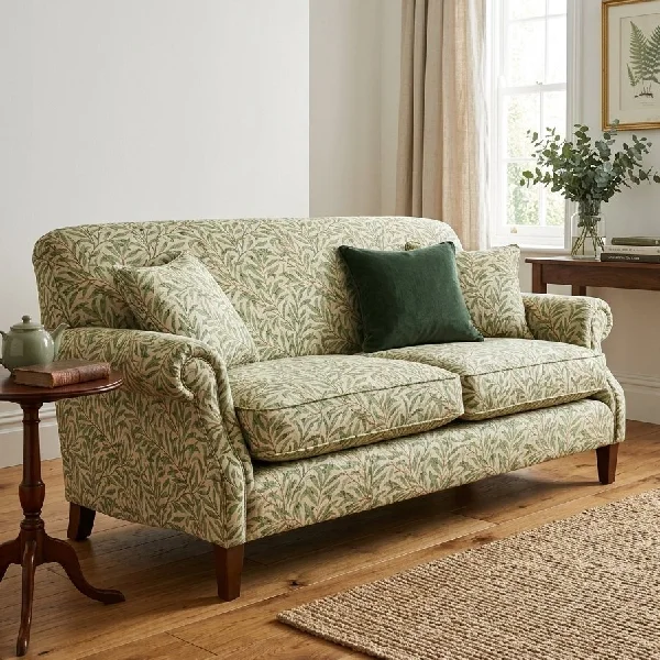 Sage green leafy pattern upholstered two-seater sofa