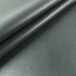 Smooth dark grey faux leather vinyl fabric folded swatch