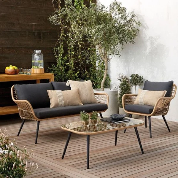 Rattan wicker outdoor sofa set on wooden deck