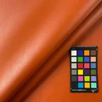 Terracotta orange vinyl upholstery swatch with color card