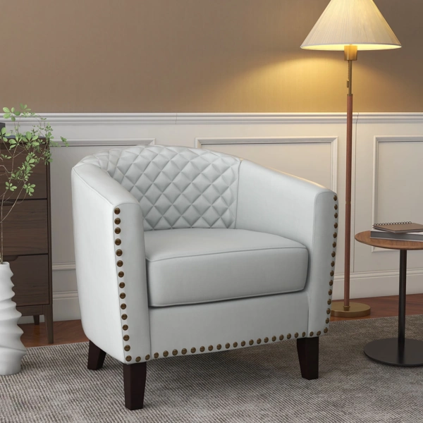 White leather armchair upholstery with nailhead trim detail