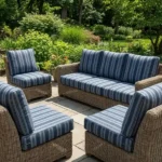 Wicker patio furniture set with blue striped cushions
